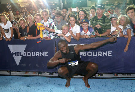 Jamaica's Olympic champion Usain Bolt poses for photographs in front of supporters after signing autographs during the Nitro Athletics series at the Lakeside Stadium in Melbourne, Australia February 4, 2017. REUTERS/Hamish Blair