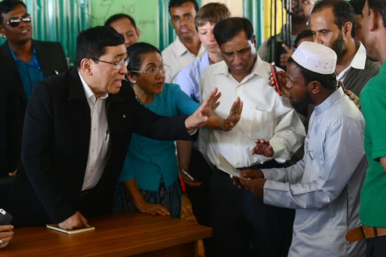 Myanmar Social Welfare Minister Win Myat Aye talks to Rohingya refugees, many of whom fear a repeat of the persecution that forced them off their lands if they go back under the repatriation deal