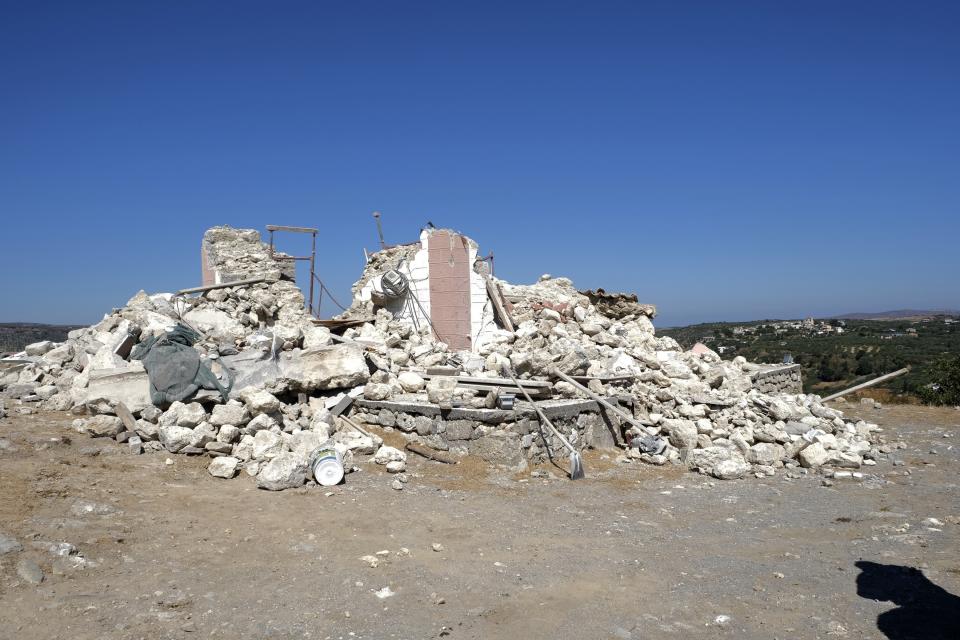 A demolished Greek Orthodox church of Profitis Ilias where a man was killed after a strong earthquake is seen in Arkalochori village on the southern island of Crete, Greece, Monday, Sept. 27, 2021. A strong earthquake struck the Greek island of Crete and killed one person and injured several more. Home and churches were damaged and rock slides occurred near the country's fourth-largest city. (AP Photo/Harry Nakos)