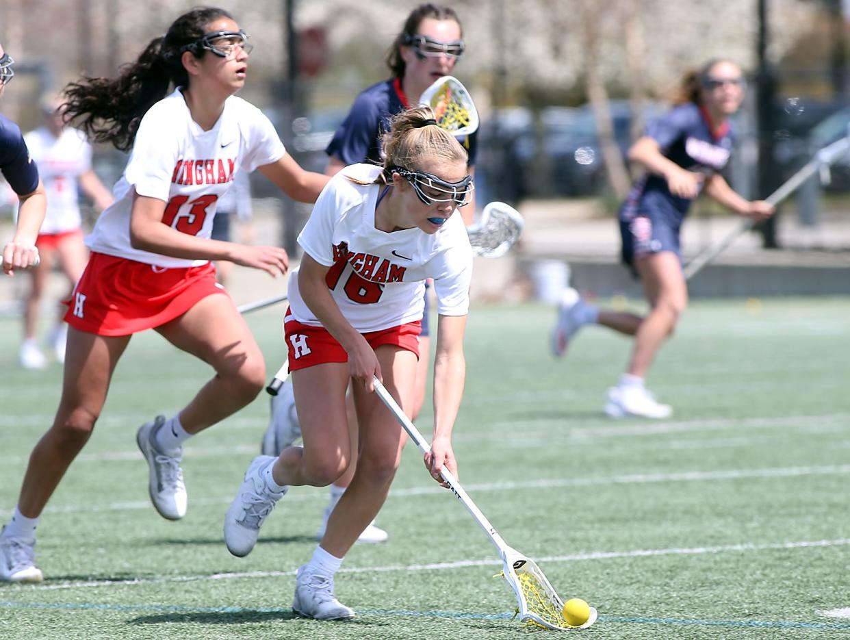 Hingham's Grace Maroney picks up the ground ball during second half action of their game against Lincoln-Sudbury at Hingham High School on Thursday, April 21, 2022.