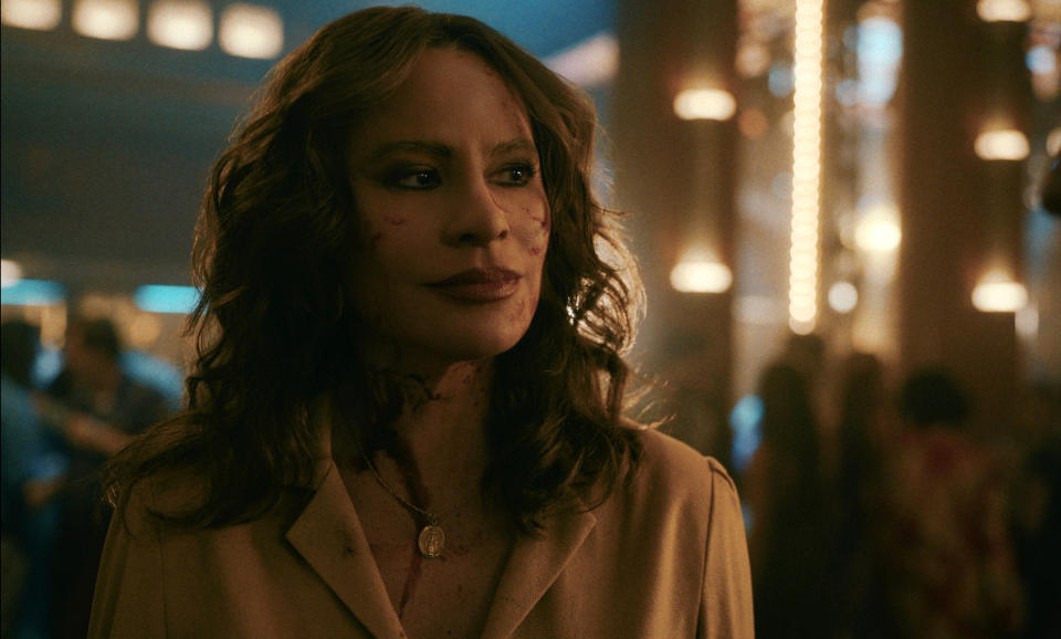 Griselda meets with drug world higher-ups in a Miami nightclub, blood still fresh on her face.<span class="copyright">Courtesy of Netflix</span>
