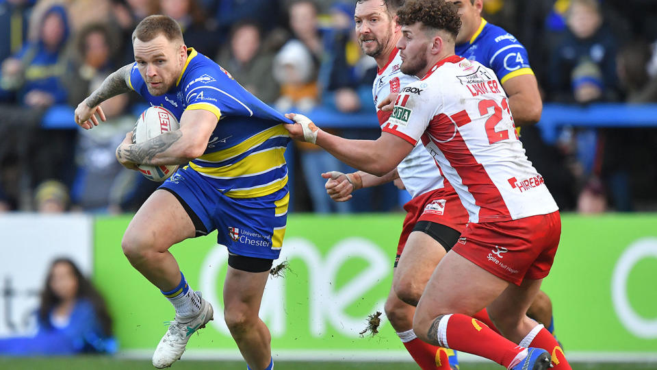 Warrington Wolves’ Blake Austin is tackled by Hull Kingston Rovers’ George Lawler during the Betfred Super League match at the Halliwell Jones Stadium, Warrington. (Photo by Dave Howarth/PA Images via Getty Images)