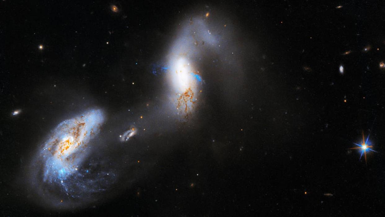  This new image from NASA’s Hubble Space Telescope shows interacting galaxies known as AM 1214-255 