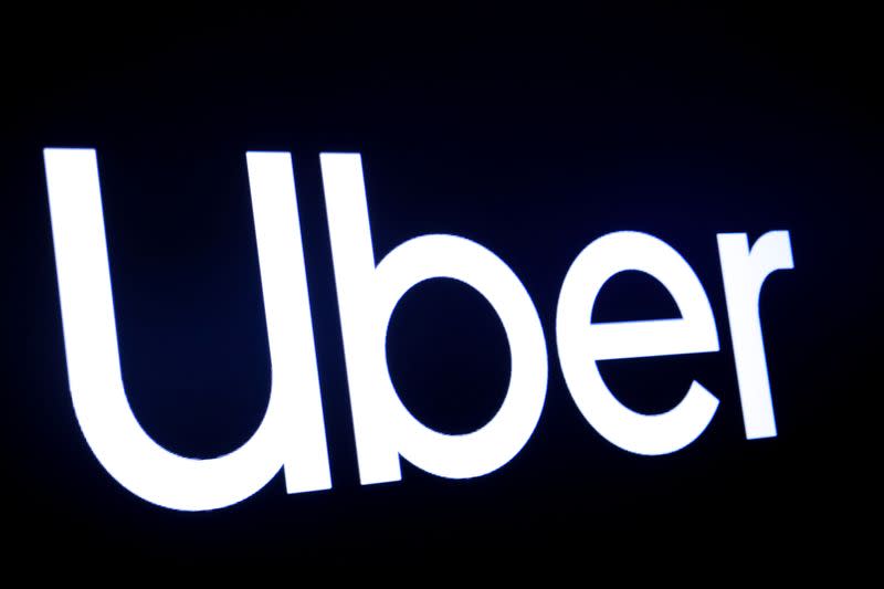 A screen displays the company logo for Uber Technologies Inc. on the day of it's IPO at the NYSE in New York