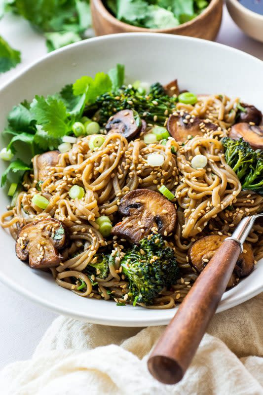 <p>This gluten free mushroom soba noodle stir fry is an easy-to-make + nourishing noodle dish that’s perfect for any weeknight dinner or quick lunch! Made with gluten free soba noodles, mushrooms, broccolini, cilantro, sesame seeds, green onions, and a delicious 4 ingredient stir fry sauce.</p><p><strong>Get the recipe: <a href="https://nyssaskitchen.com/gluten-free-mushroom-soba-noodle-stir-fry-gluten-free-vegan/" rel="nofollow noopener" target="_blank" data-ylk="slk:Gluten-Free Mushroom Soba Noodle Stir Fry;elm:context_link;itc:0;sec:content-canvas" class="link rapid-noclick-resp"><em>Gluten-Free Mushroom Soba Noodle Stir Fry</em></a></strong></p>