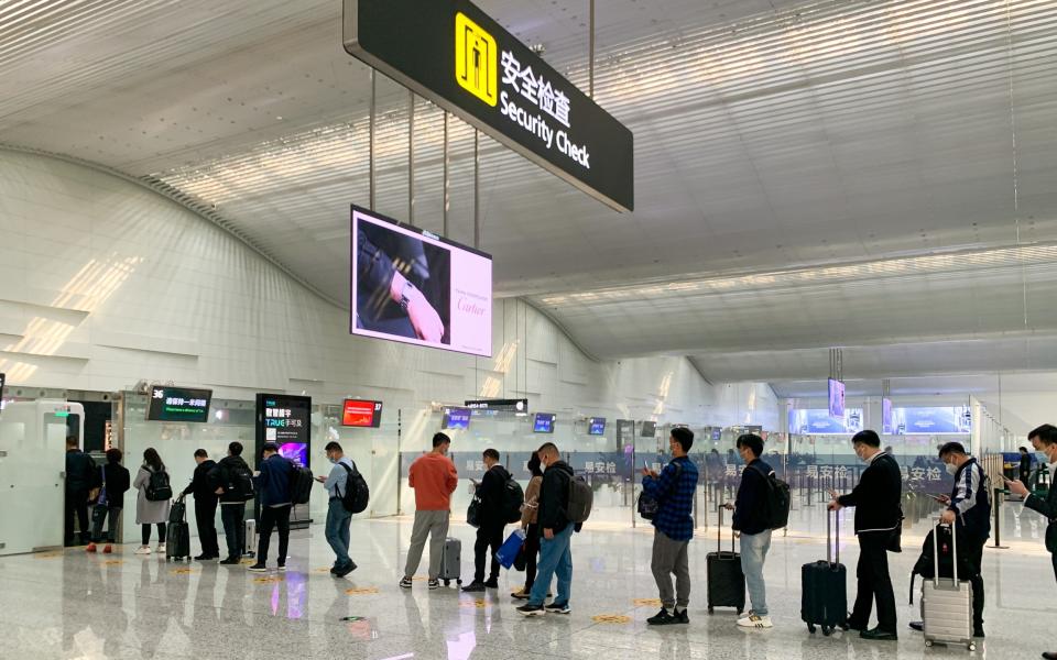 A lengthy queue for security checks at Guangzhou Baiyun International Airport in China