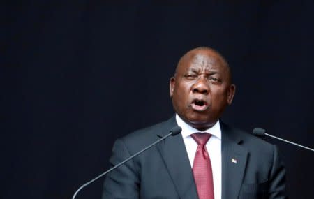 FILE PHOTO: President Cyril Ramaphosa delivers a eulogy at the funeral of Winnie Madikizela-Mandela at the Orlando stadium in Soweto, South Africa April 14, 2018. REUTERS/Mike Hutchings/File Photo
