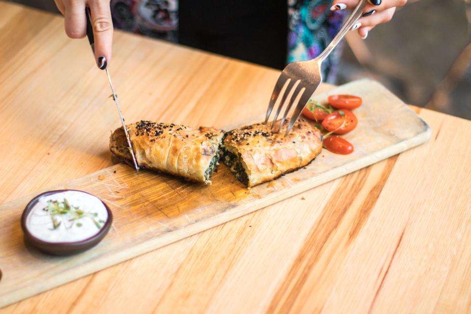 Avli restaurants make their spinach pies, including the dough. The modern Greek restaurant is coming to Brewers Hill, filling a restaurant space closed for two years.