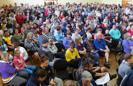 Locals gather in a town hall to discuss the bushfire situation in Cobden, located south west of Melbourne in Australia, March 18, 2018. Picture taken March 18, 2018. AAP/David Crosling/via REUTERS