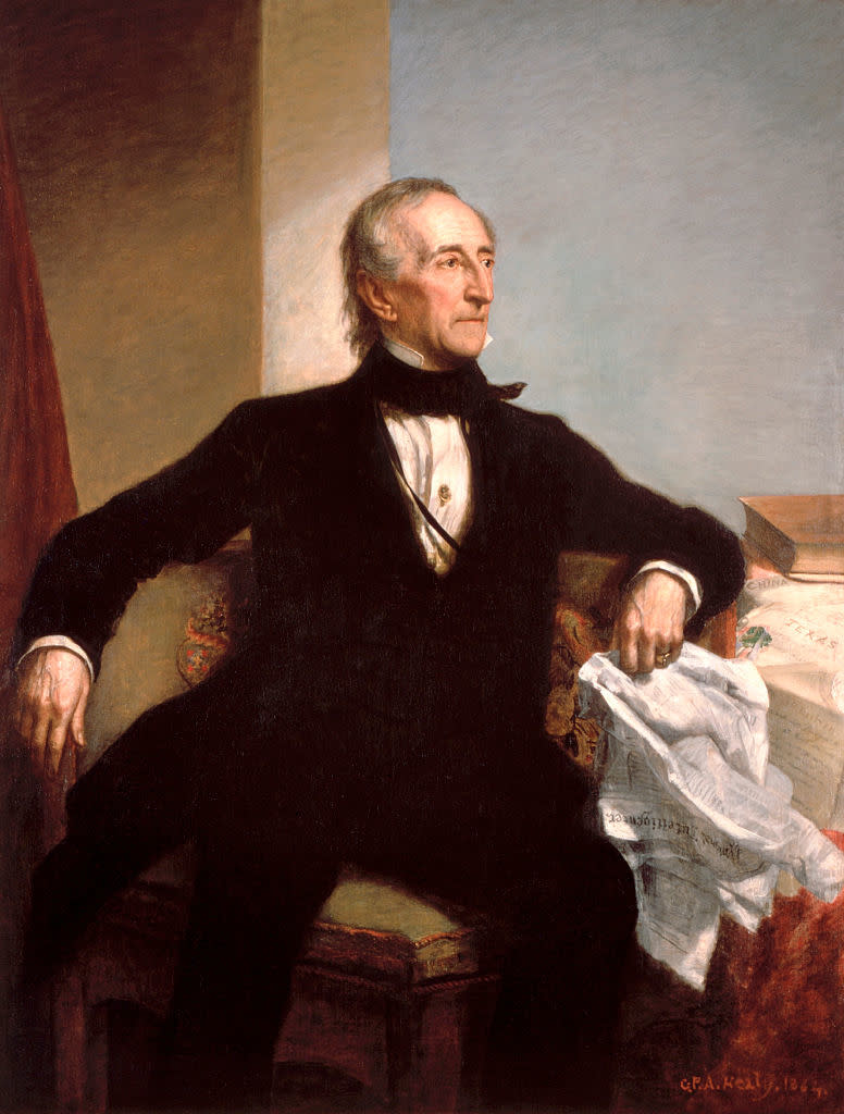 Portrait of Samuel Morse with his telegraph. He's seated, wearing a formal black suit