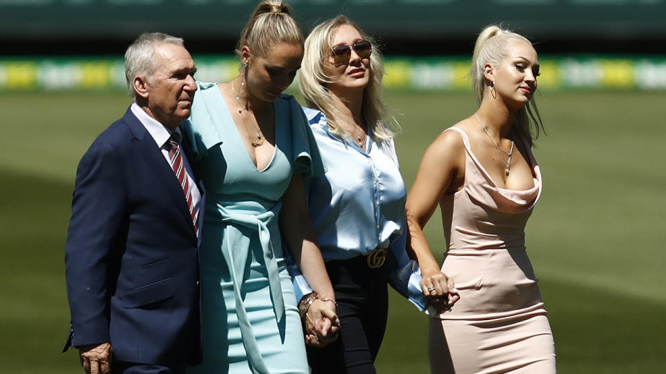 Allan Border, pictured here with Dean Jones' wife Jane and daughters Phoebe and Augusta during a tribute at the MCG. 