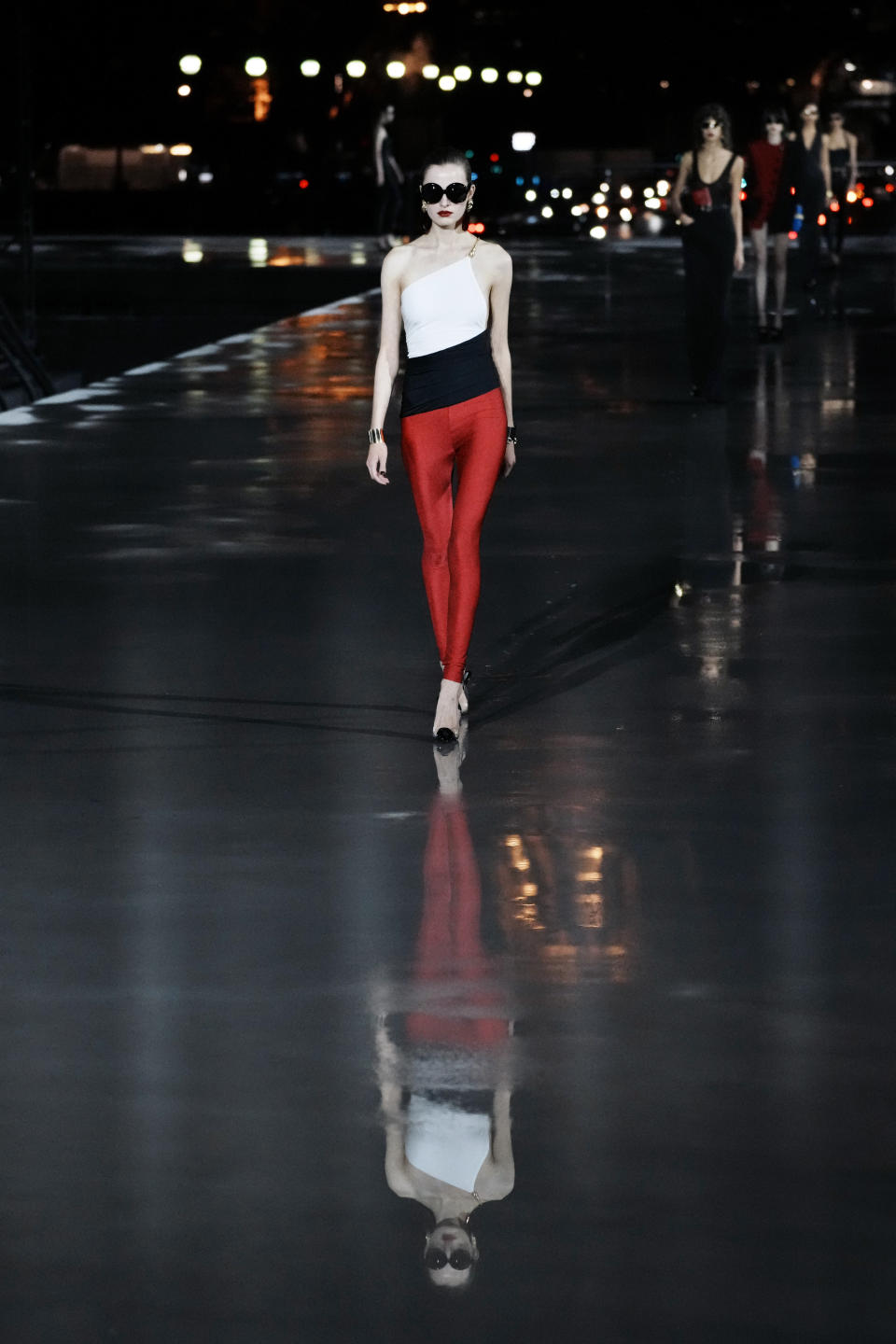 A model wears a creation for Saint Laurent Spring-Summer 2022 ready-to-wear fashion show presented Tuesday, Sept. 28, 2021, in Paris. (AP Photo/Thibault Camus)