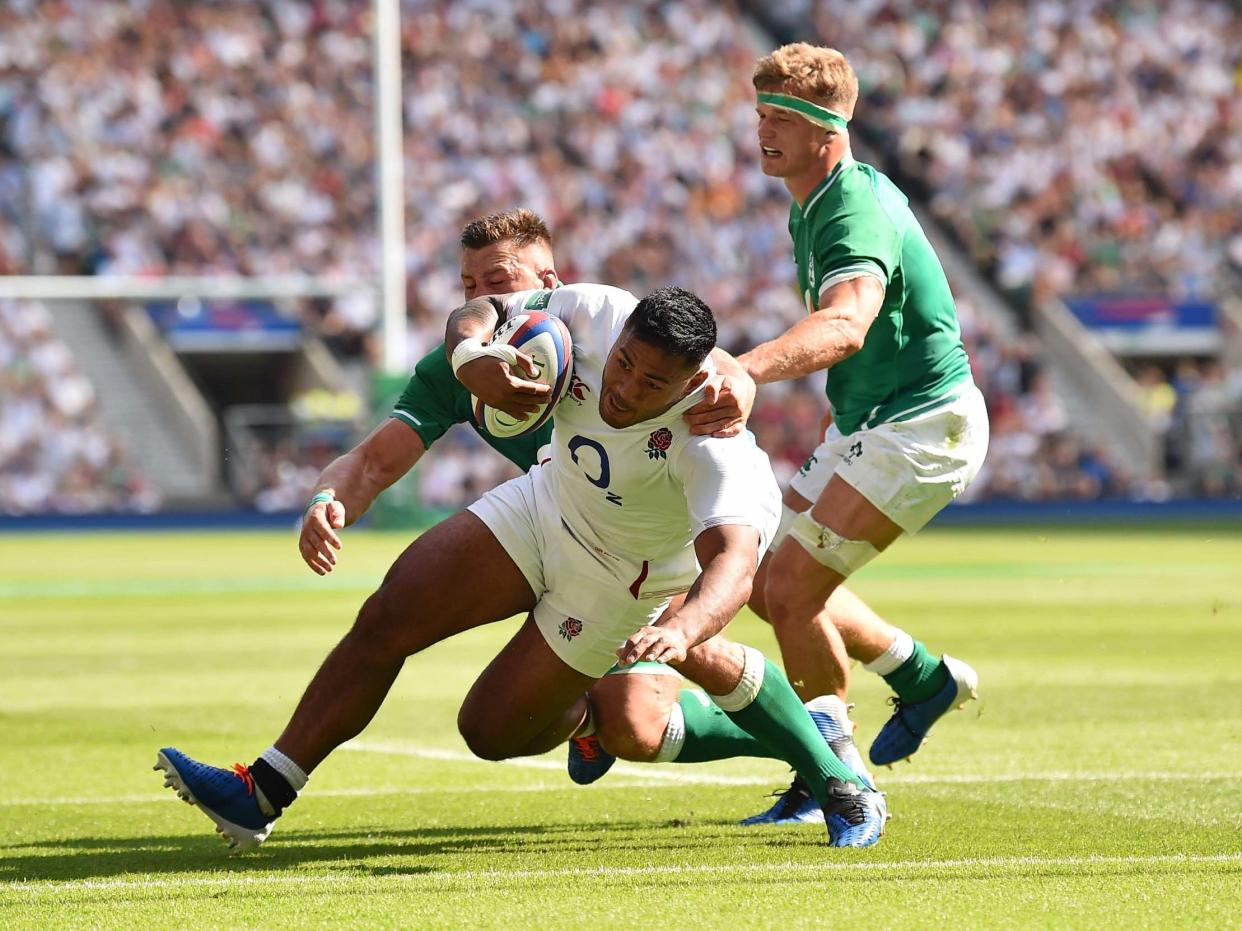 Manu Tuilagi scores England's third try against Ireland: AFP/Getty