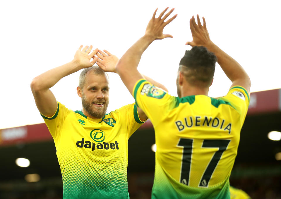 NORWICH, ENGLAND - SEPTEMBER 14: Teemu Pukki of Norwich City celebrates with teammate Emiliano Buendia of Norwich City after scoring his team's third goal  during the Premier League match between Norwich City and Manchester City at Carrow Road on September 14, 2019 in Norwich, United Kingdom. (Photo by Marc Atkins/Getty Images)