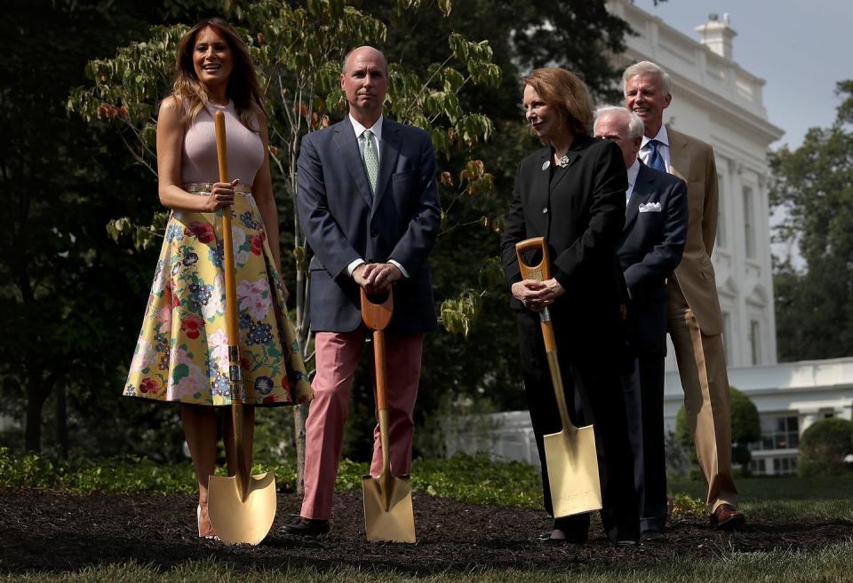 <p>The First Lady stuck with the theme of the day wearing a floral Valentino skirt during a tree planting ceremony on the South Lawn in the early weeks of August 2018. </p>