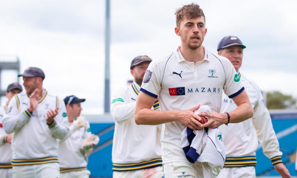 Yorkshire’s Ben Coad leads the team off the field after taking 10 wickets in the match on the way to beating Nottinghamshire.