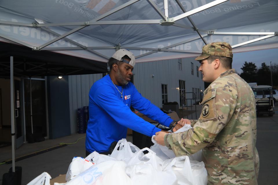 Vincent Davis and PFC Chance Dachon volunteer at Mosaic Church the week of the tornado that hit Clarksville, Tenn. on Dec. 9, 2023.