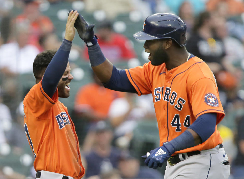 Houston Astros' Yordan Alvarez (44) celebrates with Jose Altuve after hitting a two-run home run that scored the pair during the sixth inning of the second baseball game of a doubleheader against the Detroit Tigers, Saturday, June 26, 2021, in Detroit. (AP Photo/Duane Burleson)