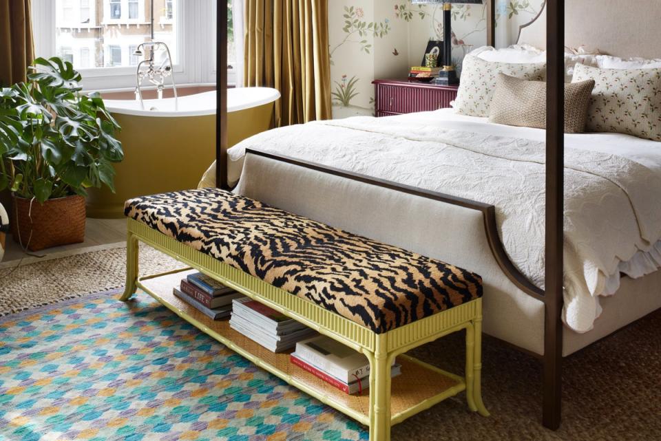 In Tiffany Duggan’s home design, a slightly smaller than standard bath fits into the bay window of her bedroom, with thick, velvet curtains ensuring complete privacy (Rachael Smith Photography Ltd)