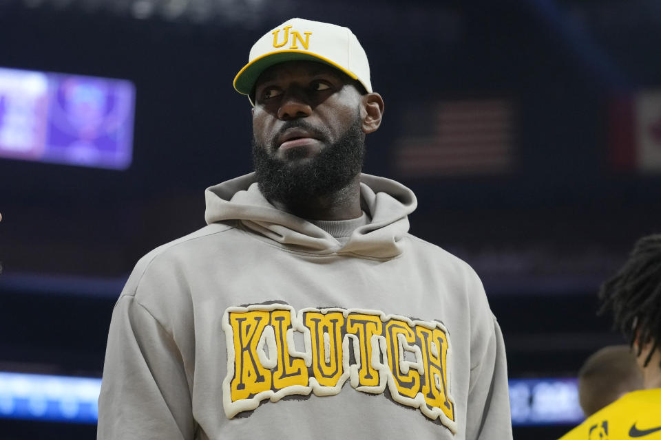 Injured Los Angeles Lakers forward LeBron James stands on the court during a timeout in the first half of the team's NBA basketball game against the Golden State Warriors in San Francisco, Thursday, Feb. 22, 2024. (AP Photo/Jeff Chiu)