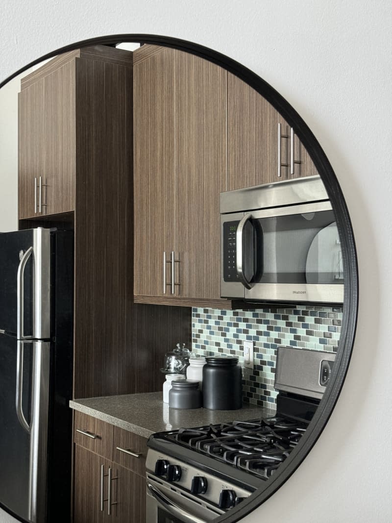 A mirror reflexing the kitchen.