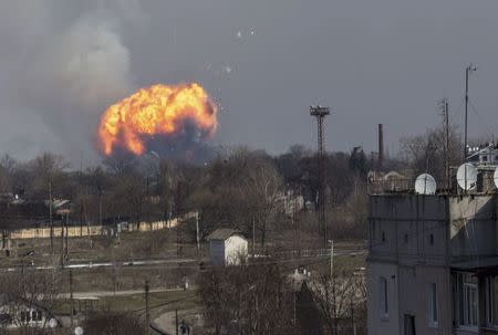 Flames shoot into the sky from a warehouse storing tank ammunition at a military base in the town of Balaklia (Balakleya), Kharkiv region, Ukraine, March 23, 2017. REUTERS/Alexander Sadovoy