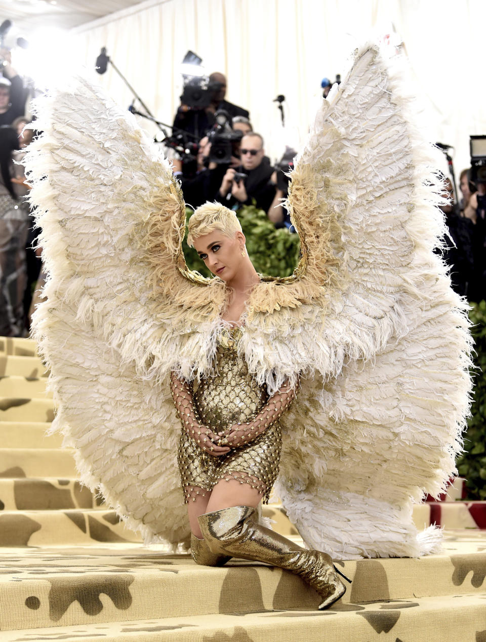 FILE - In this May 7, 2018 file photo, singer Katy Perry wears angel wings at The Metropolitan Museum of Art's Costume Institute benefit gala celebrating the opening of the Heavenly Bodies: Fashion and the Catholic Imagination exhibition in New York. (Photo by Evan Agostini/Invision/AP, File)