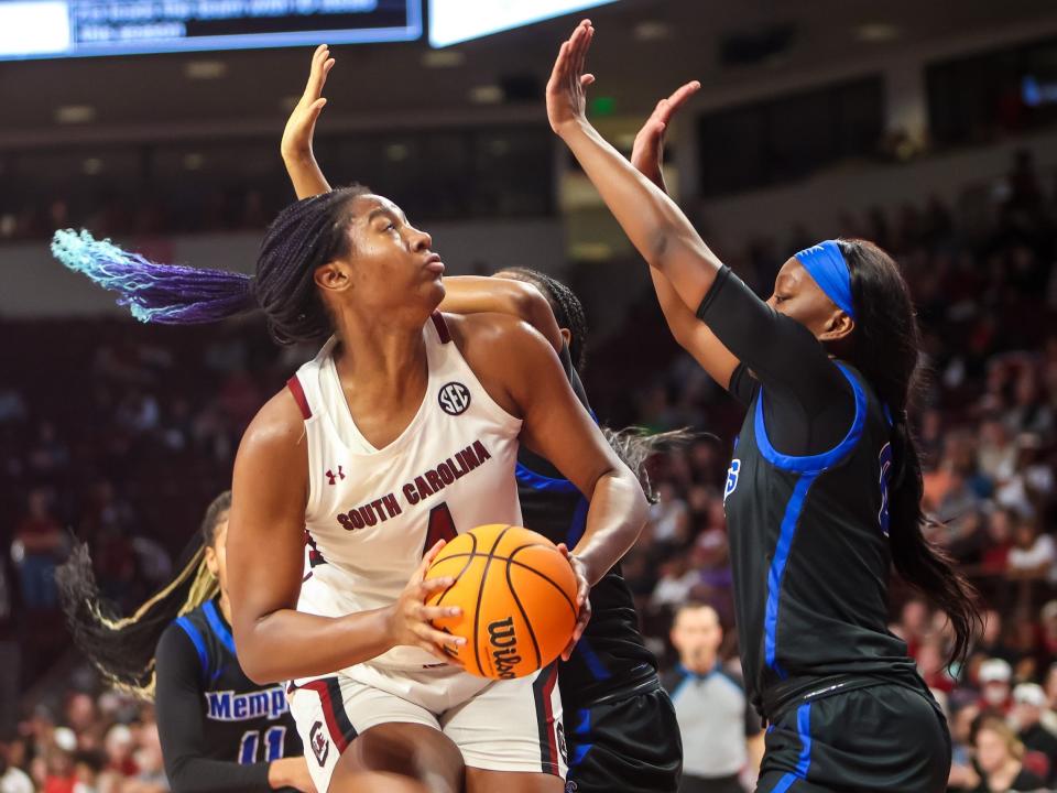 Aliyah Boston faces multiple Memphis Tigers defenders.