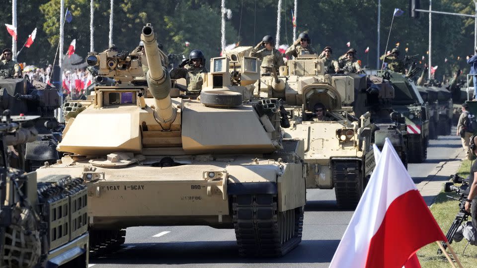 US-made Abrams tanks are displayed during a massive military parade to celebrate the Polish Army Day in Warsaw. - Czarek Sokolowski/AP