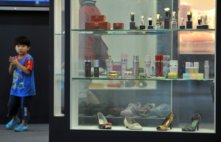 A child looks at products made in North Korea's Kaesong joint industrial complex displayed at a showroom at a South Korean observation post in the border town of Paju near the Demilitarized Zone (DMZ), on June 6, 2013. Kaesong complex was established in 2004 as a symbol of inter-Korean cooperation