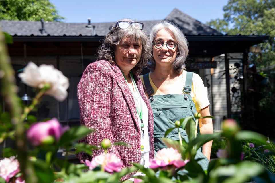 Sharron Johnson and Kim Halyak, the co-chairs of the Cooper-Young Garden Club, pose for a portrait in Halyak’s backyard garden in Memphis, Tenn., on May 2, 2023. Halyak’s garden will be featured in the “Experience Memphis Gardens” event that they both helped organize.