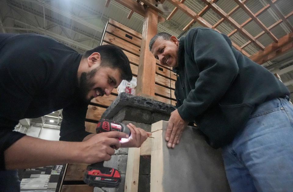 Laborer Licandro Vques, left, and Foreman Arturo Queveto, right, with Breckinridge Landscape, Design, Construction & Maintenance, put the finishing touches on their display prior to the 97th annual Realtors Home & Garden Show which starts Friday, March 24, 2023, through Sunday, April 2, 2023, at Exposition Center at Wisconsin State Fair Park in West Allis.