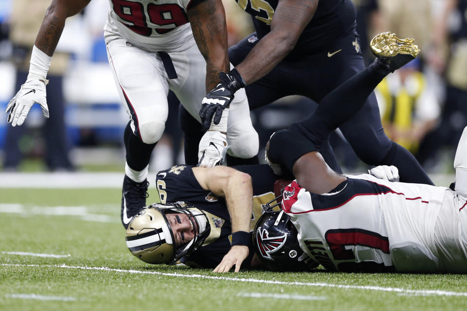 New Orleans Saints quarterback Drew Brees (9) is sacked by Atlanta Falcons defensive tackle Grady Jarrett (97) and defensive tackle Shy Tuttle (99) in the second half of an NFL football game in New Orleans, Sunday, Nov. 10, 2019. (AP Photo/Rusty Costanza)