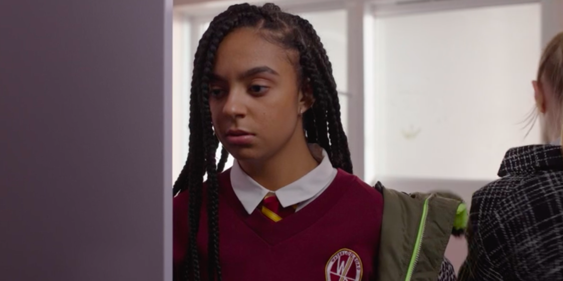 a young girl with braids