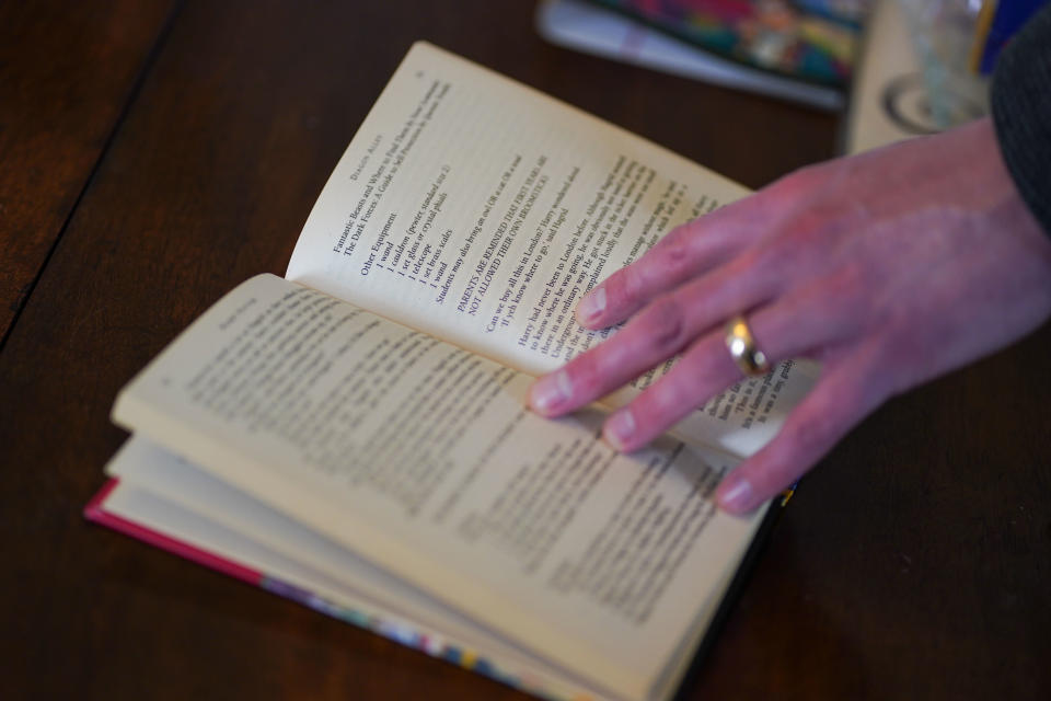 Auctioneer Jim Spencer shows an error unique to first edition copies of JK Rowling's Harry Potter and the Philosopher's Stone, the repeat '1 wand' in the equipment list. The pristine book is one of only 500 produced in the first print run in 1997, on display at Hansons' Auctioneers at Bishton Hall, Staffordshire. The book has never been read and was kept in darkness for 25 years inside a protective sleeve and could fetch up to £100,000 when it goes under the hammer at Hanson's Library Auction on March 9. Picture date: Monday March 7, 2022. (Photo by Jacob King/PA Images via Getty Images)