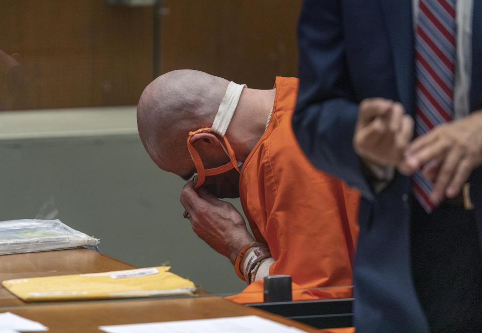 Michael Thomas Gargiulo adjusts his face mask during a sentencing hearing at Los Angeles Superior Court, Friday, July 16, 2021. Gargiulo has pleaded not guilty to two counts of murder and an attempted-murder charge stemming from attacks in the Los Angeles area between 2001 and 2008, including the death of Kutcher's former girlfriend, 22-year-old Ashley Ellerin. A judge denied a new trial for Garigiulo, a man prosecutors called “The Boy Next Door Killer,” who could be sentenced to death later Friday for the home-invasion murders of two women and the attempted murder of a third. (AP Photo/Damian Dovarganes)