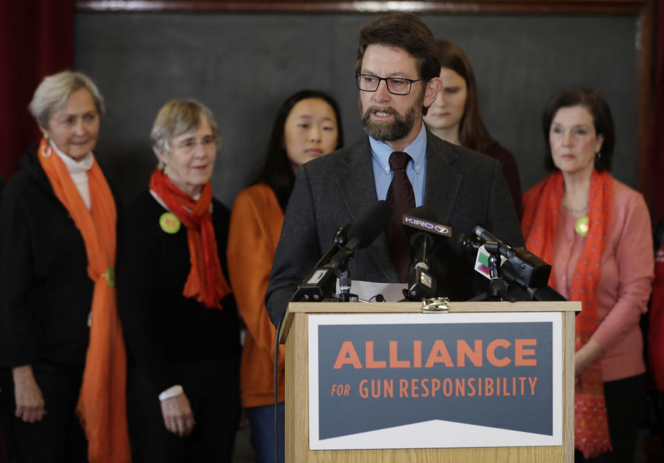 FILE - Paul Kramer, the citizen sponsor of an initiative which increased restrictions on the purchase and ownership of firearms, speaks about efforts in Washington state to reduce gun violence on Feb. 14, 2019, in Seattle. The man who shot and killed four people at a Tulsa, Okla., hospital bought his AR-style semiautomatic rifle just hours before he began the killing spree. That would not have been possible in Washington and some other states that have waiting periods of days or even more than a week before people can take possession of such weapons. (AP Photo/Ted S. Warren, File)
