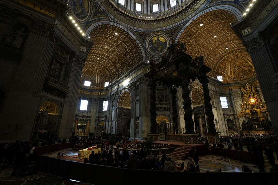 The body of late Pope Emeritus Benedict XVI is lied out in state inside St. Peter's Basilica at The Vatican, Wednesday, Jan. 4, 2023. Pope Benedict, the German theologian who will be remembered as the first pope in 600 years to resign, has died, the Vatican announced Saturday, Dec. 31, 2022. He was 95.(AP Photo/Ben Curtis)