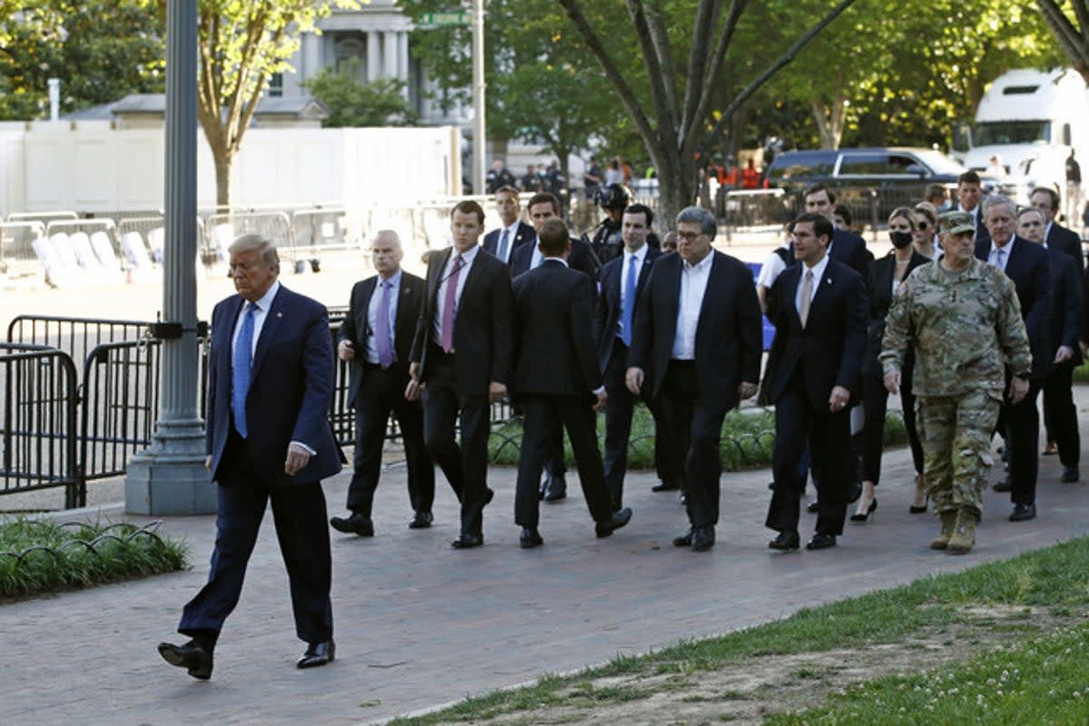 President Donald Trump walks in Lafayette Park to visit outside St. John’s Church across from the White House on June 1, 2020.  Mark Milley is seen wearing his military uniform in the picture (Patrick Semansky/AP Photo)