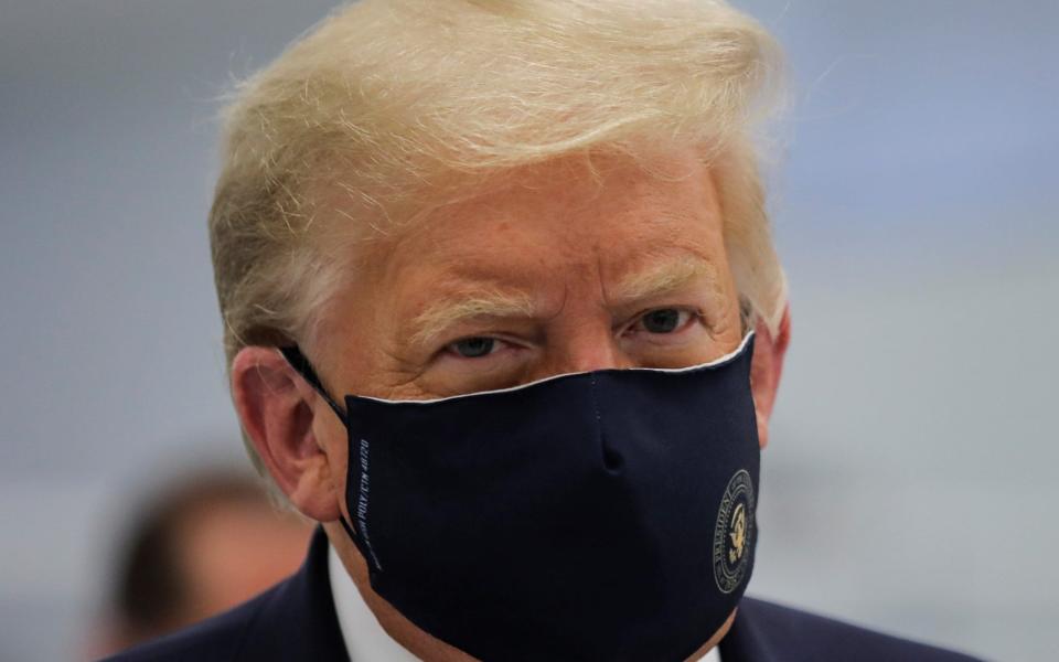 Donald Trump has begun wearing a face mask in public in recent weeks - REUTERS/Carlos Barria