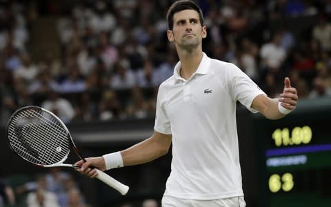 Novak Djokovic wins the third-set tie-break - Credit: BEN CURTIS/AFP