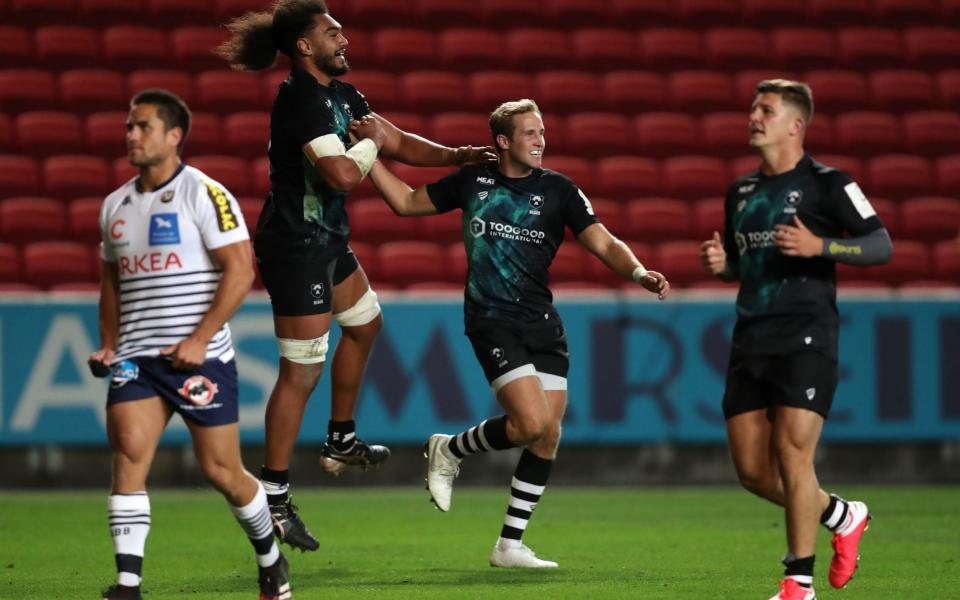 Max Malins (centre) celebrates scoring his side's second try of the game for Bristol Bears - PA