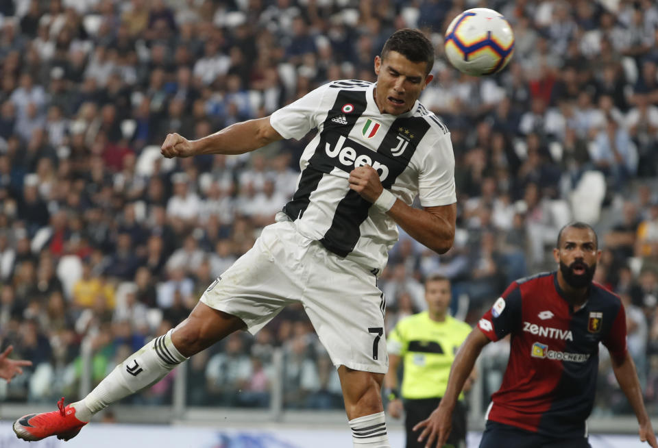 Juventus' Cristiano Ronaldo heads the ball to hit the post during an Italian Serie A soccer match between Juventus and Genoa, at the Alliance stadium in Turin, Italy, Saturday, Oct. 20, 2018. (AP Photo/Antonio Calanni)