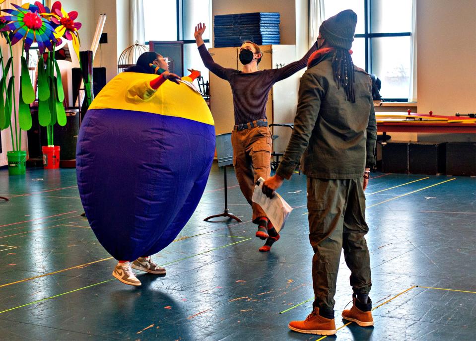 Antonisia Collins, left, of Montgomery is in her inflatable suit to play Tweedle Dum, and Keegan Robinson, middle, as Tweedle Dee in rehearsal for "Alice in Wonderland" with movement director Darrius Strong at Children's Theatre Company.
