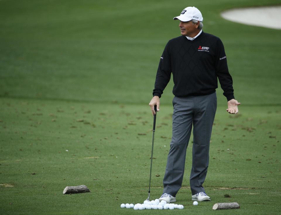 Fred Couples waits to his on the driving range during a practice round for the Masters golf tournament Tuesday, April 8, 2014, in Augusta, Ga. (AP Photo/Matt Slocum)