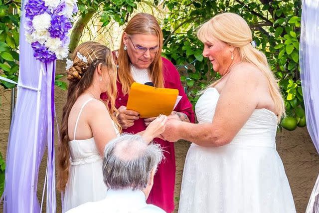 <p>Kristyn Weed</p> From left to right, bride Lyn Weed, Sue McConnell officiating and bride Kriss Weed
