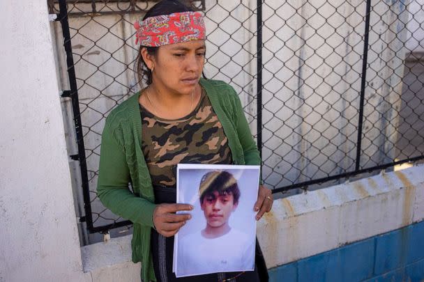 PHOTO: Maria Sipac Coj holds a portrait of her son, Pascual Melvin Guachiac, in Tzucubal, Guatemala, June 29, 2022.  (Moises Castillo/AP)