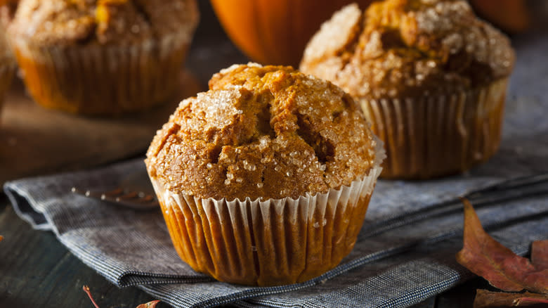 Pumpkin muffins on tea towel