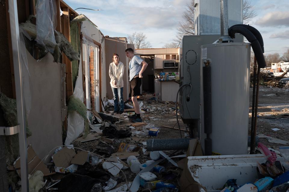 WINCHESTER, INDIANA - MARCH 15: Residents clean up after a tornado ripped through town on March 15, 2024 in Winchester, Indiana. At least three people have been reported killed after a series of tornadoes ripped through the midwest yesterday.