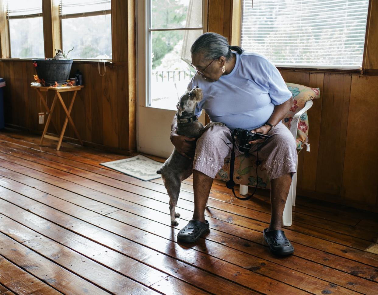 <span class="caption">Pet parenting can provide love and companionship to both human and animal.</span> <span class="attribution"><a class="link " href="https://www.gettyimages.com/detail/photo/senior-black-woman-patting-the-family-dog-royalty-free-image/1190823862" rel="nofollow noopener" target="_blank" data-ylk="slk:Willie B. Thomas/DigitalVision via Getty Images;elm:context_link;itc:0;sec:content-canvas">Willie B. Thomas/DigitalVision via Getty Images</a></span>